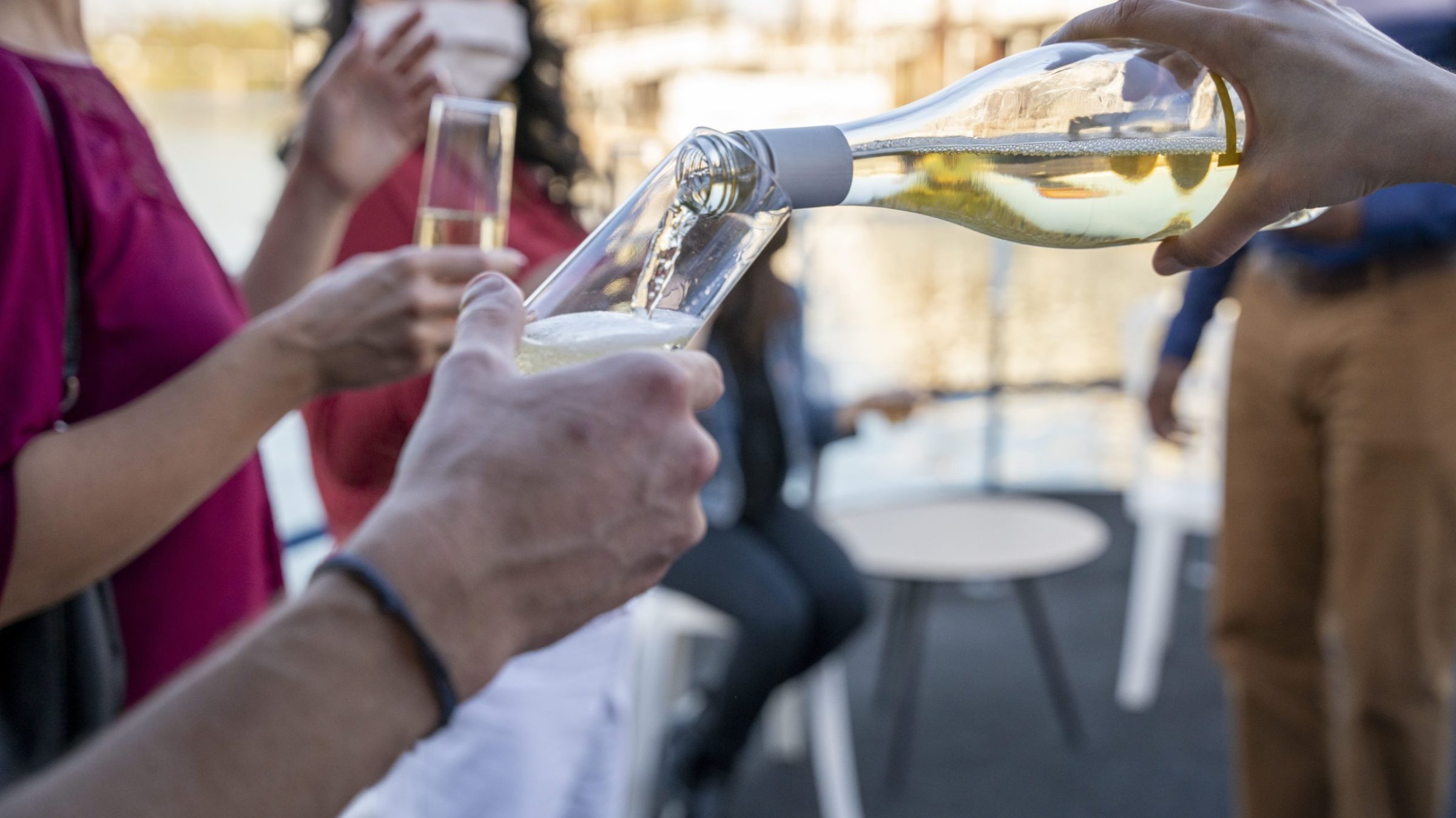 a person holding a glass of wine