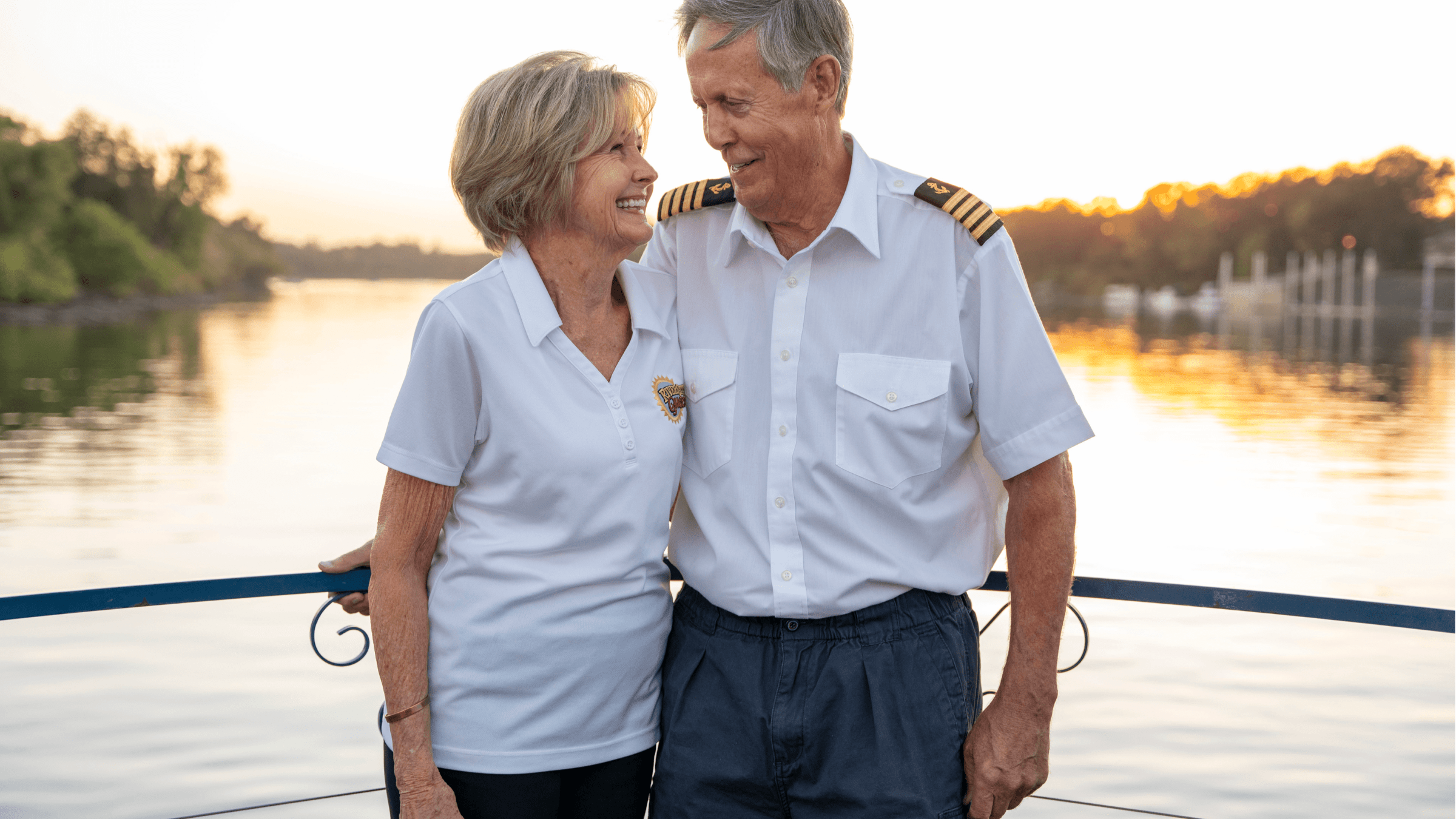 a man standing next to a body of water