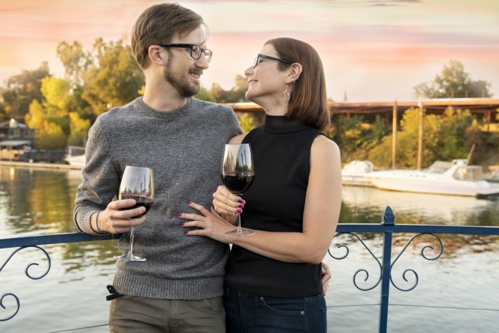a person standing next to a body of water